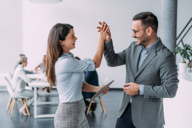 istock Two colleagues celebrating success. 2173063019