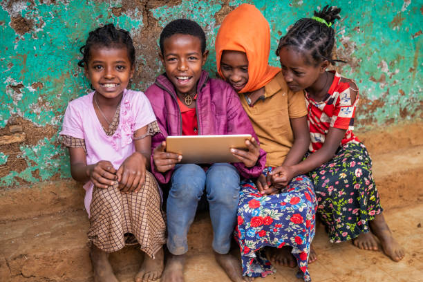 istock African children using digital tablet, East Africa 2173063105