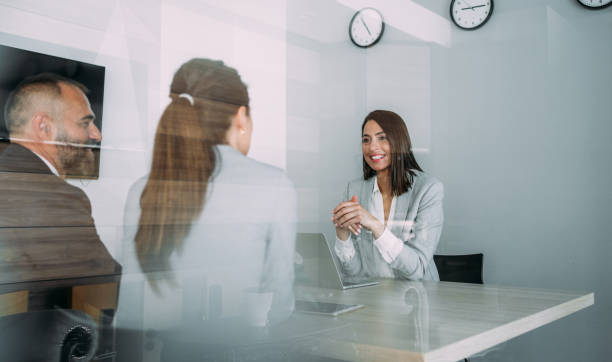 Group of business persons talking in the office.