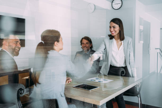 istock Businesswomen shaking hands across the table. 2173063140