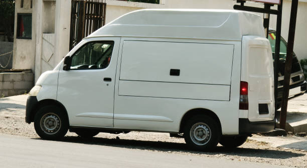 istock Compact white van in the city street. 2173063189