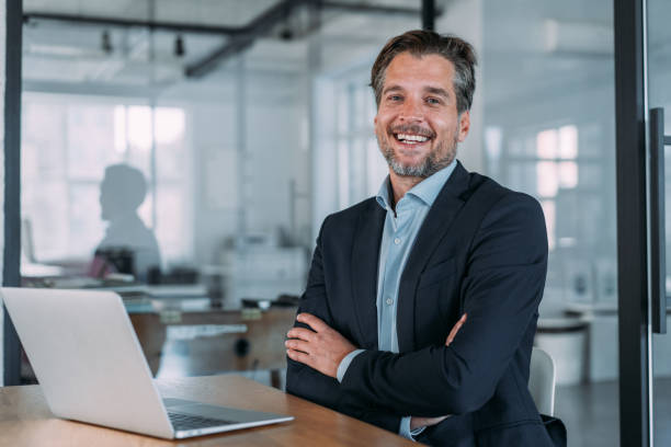 istock Successful businessman in modern office working on laptop. 2173063518