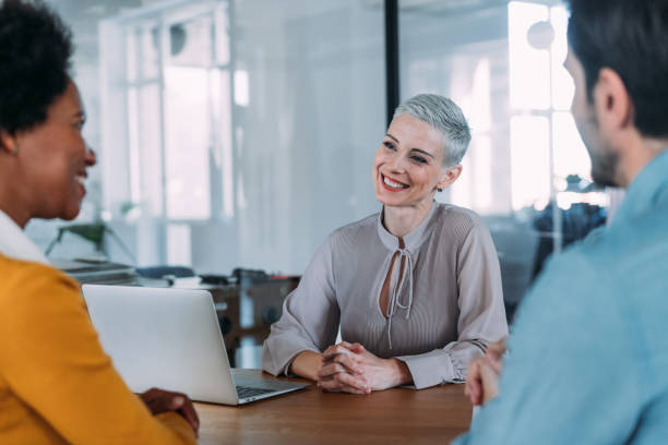istock Group of business persons talking in the office. 2173063698