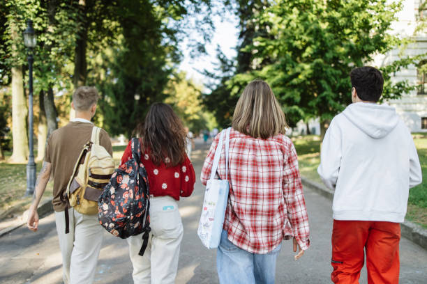 istock Group of Students Proudly Walking to University Through the Park 2173064472