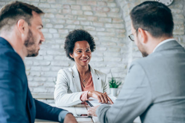 istock Group of business persons talking in the office. 2173064636