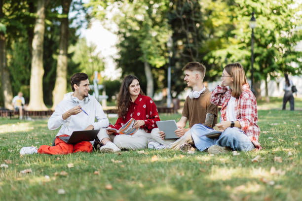 istock Group of Young Students Engaged in Discussion at the Park 2173065388