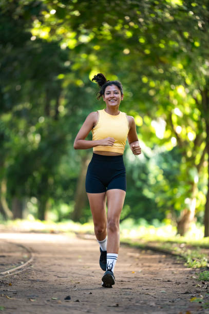 istock Young happy athletic woman running in nature 2173065507