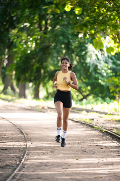 istock Happy athletic woman jogging while exercising in the park. 2173065544