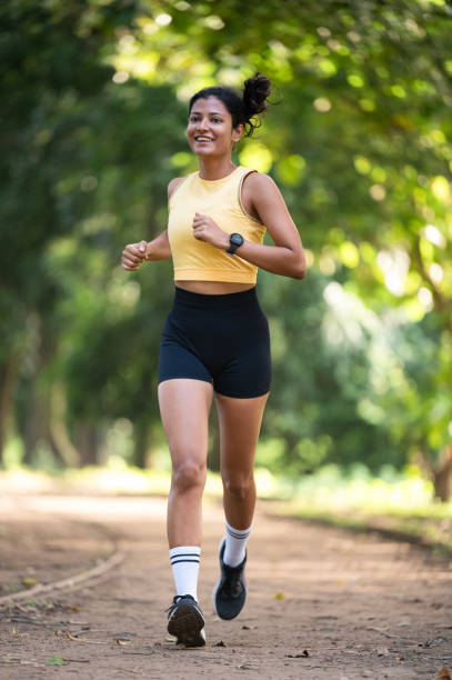 istock Female runner in a park 2173065562