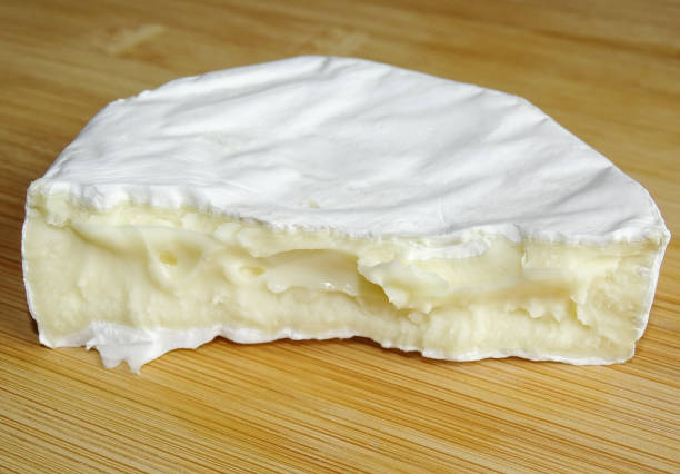istock Camembert cheese on wooden background 2173067040