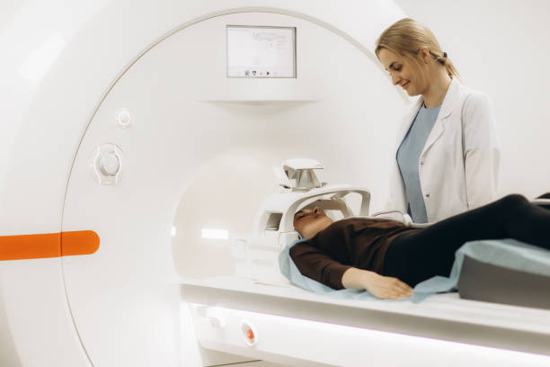 istock Doctors preparing patient for full body scanning procedure inside MRI diagnostic center. 2173068526