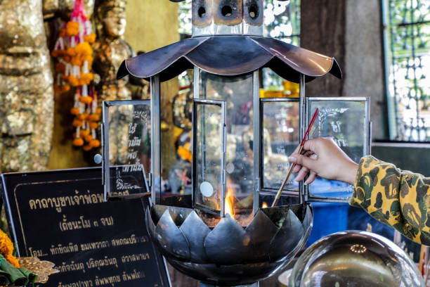 Phra Kan Shrine, Lopburi, an ancient site located in the middle of a roundabout. Inside is the shrine of Chao Pho Phra Kan, an ancient deity from the Khmer period. Many monkeys live in this area.