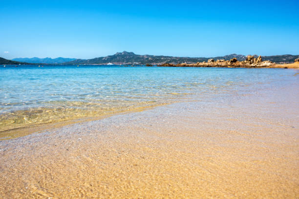 istock Beautiful, gently sloping sandy beach on the Sardinia under a blue sky 2173071112