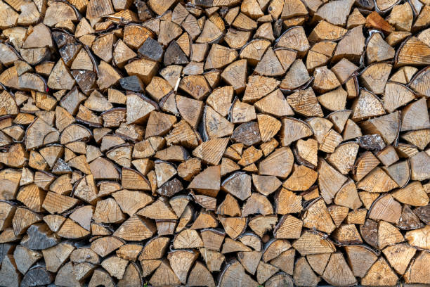 istock Stacked firewood as a wooden background in a rustic style 2173071611