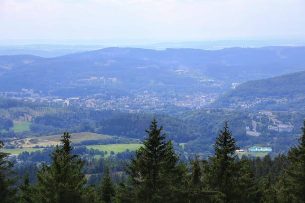 istock View of valley and town Suhl surrounded by forested hills and distant rolling mountains 2173072806
