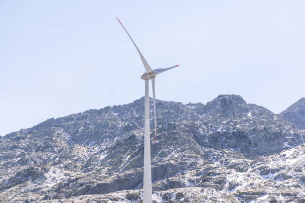 Wind turbines on a renewable energy farm in a rural Serbian landscape, operating under bright sunny skies, highlighting sustainable green energy sources.