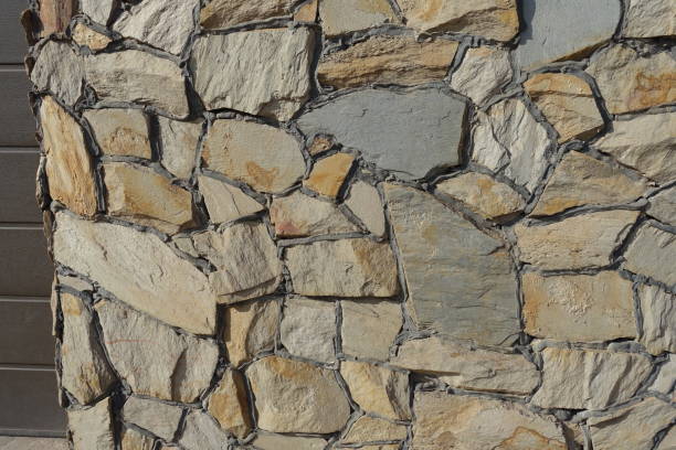istock wall made of beige natural shape field stones 2173077720