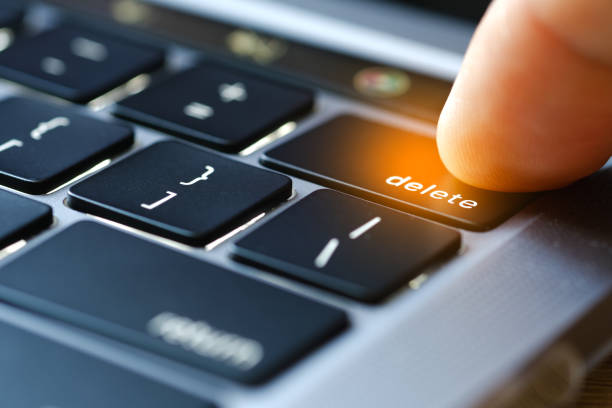 istock Finger of the computer user, he presses the delete button on the computer keyboard. 2173079208