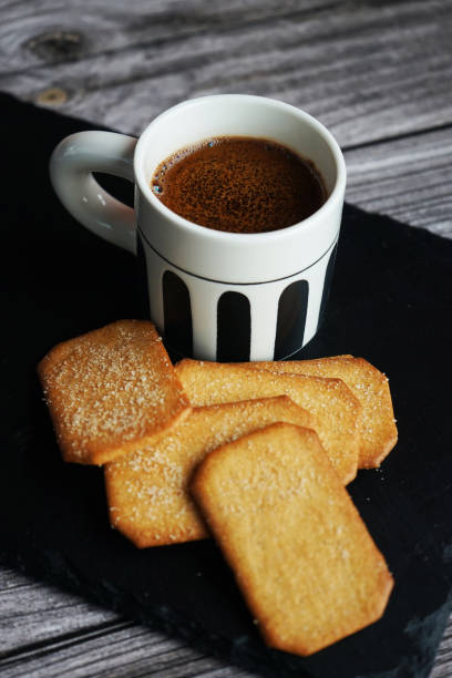 istock Cup of coffee next to cinnamon sugar cookies 2173082071
