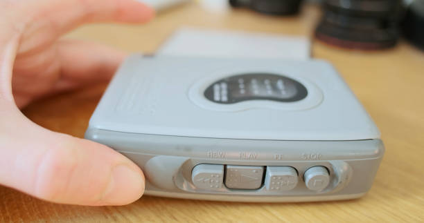 istock cassette and press the play button. Close-up, indoors, portable cassette player, Retro cassette player quickly rewinds the cassette. Rewind button, the process of listening to music on audio cassettes 2173085178