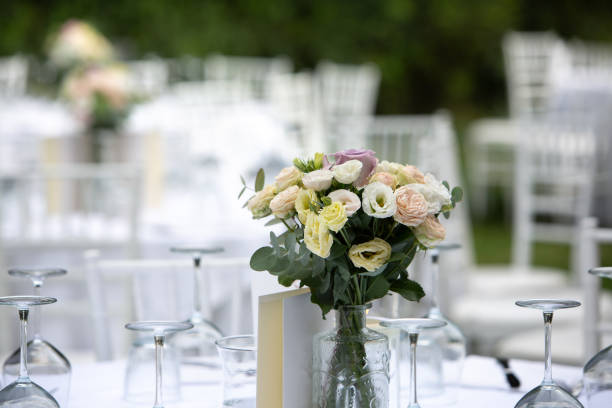 istock Floral arrangement standing on a table is decorating a wedding reception venue 2173085795