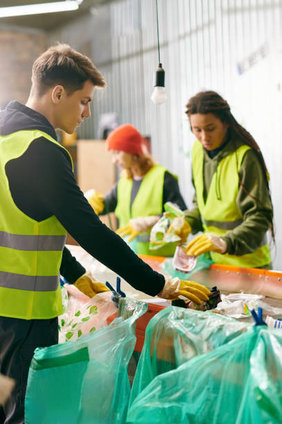 istock Young volunteers collect waste at a community center for eco-friendly projects 2173086740