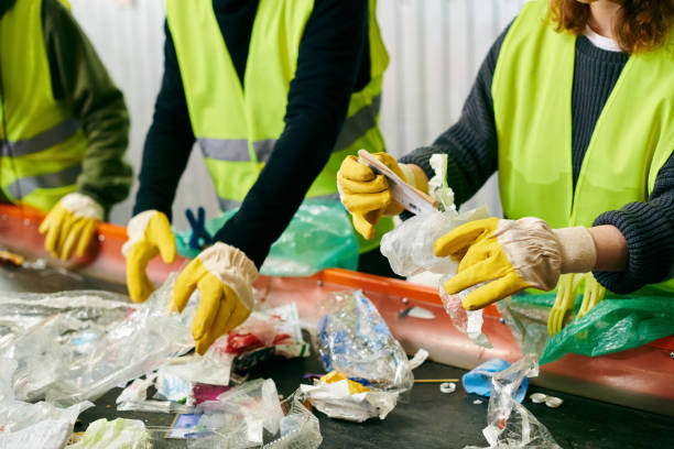 istock Young volunteers sort waste to promote eco-friendly practices and sustainability 2173086766