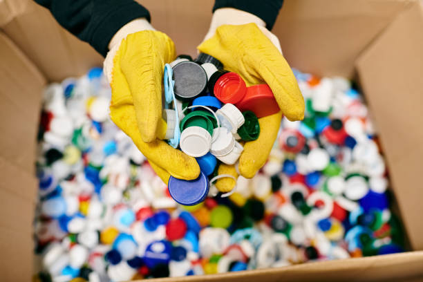 istock Young volunteer sorting plastic caps during a community clean-up for a sustainable future 2173086771
