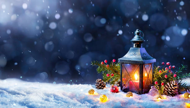 Christmas Lantern On Snow With Decorations In Abstract Cold Night