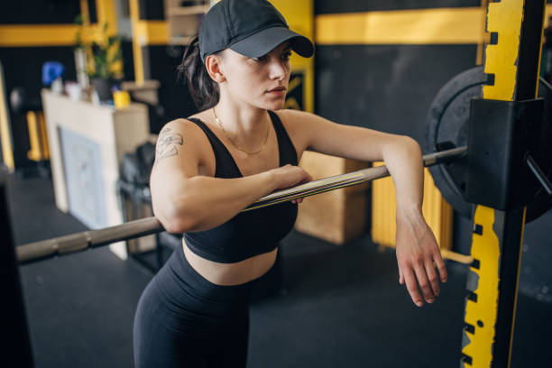 istock Athletic female in gym, reflecting while resting calm 2173087322