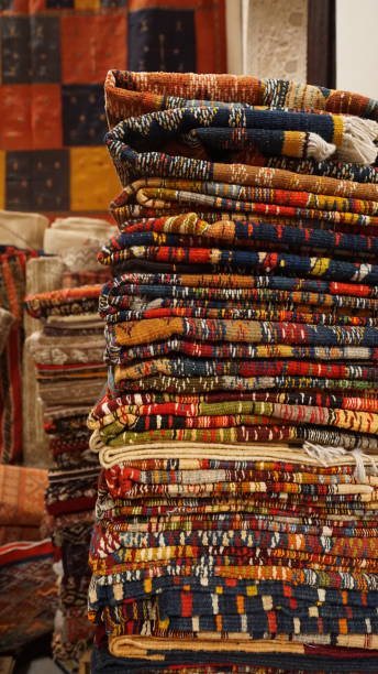 istock Stack of Colorful Moroccan Rugs in a Fez Bazaar 2173088219