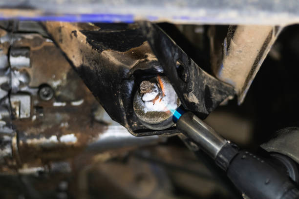 istock Anonymous repairman removing car details with torch during work in auto service 2173088255
