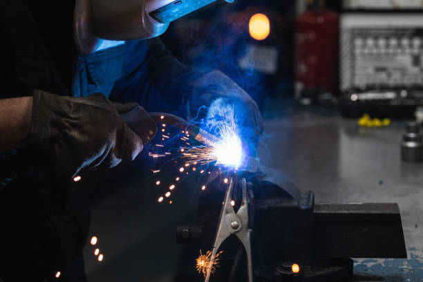 istock Anonymous mechanic welding metal construction in workshop 2173088411
