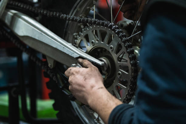 istock Unrecognizable mechanic repairing motorcycle in garage 2173089205