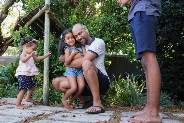 istock Father embracing daughter in garden 2173089578