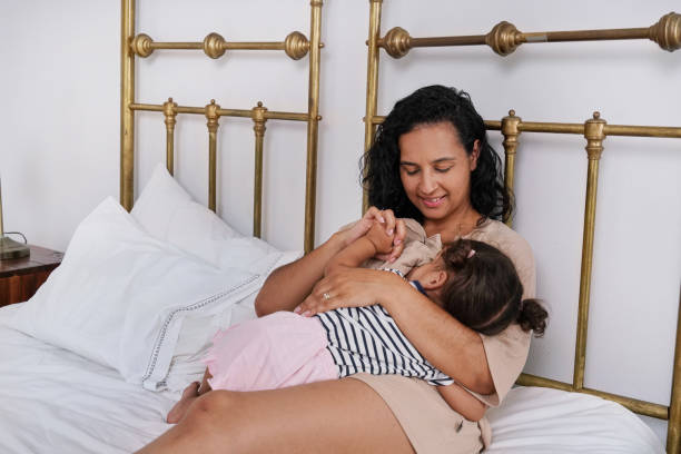 istock Mother with daughter on bed 2173089898