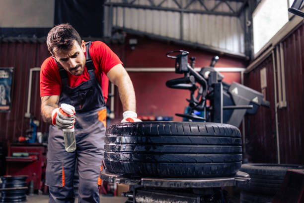 istock Tire repairman looking for puncture. 2173090047