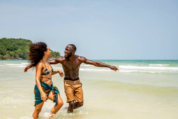 istock Happy Couple Enjoying a Fun Day at the Beach 2173090230