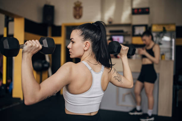 istock Focused athlete lifting weights in modern gym 2173091025