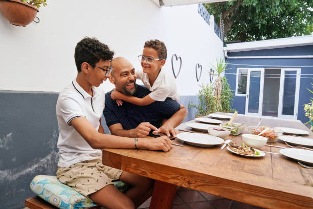 istock Father with sons on patio 2173091524