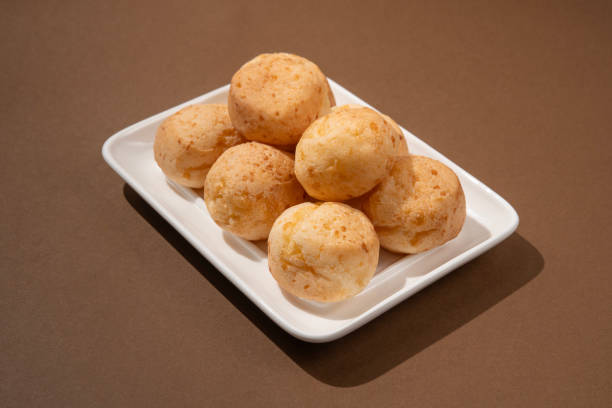 istock stack of Brazilian pao de queijo mineiro, brownbackground 2173092176