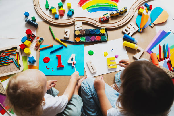 istock Children drawing and making crafts in kindergarten or daycare. 2173093780