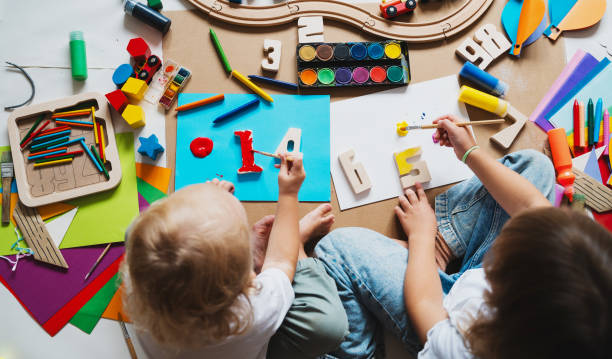 istock Children drawing and making crafts in kindergarten or daycare. 2173093789