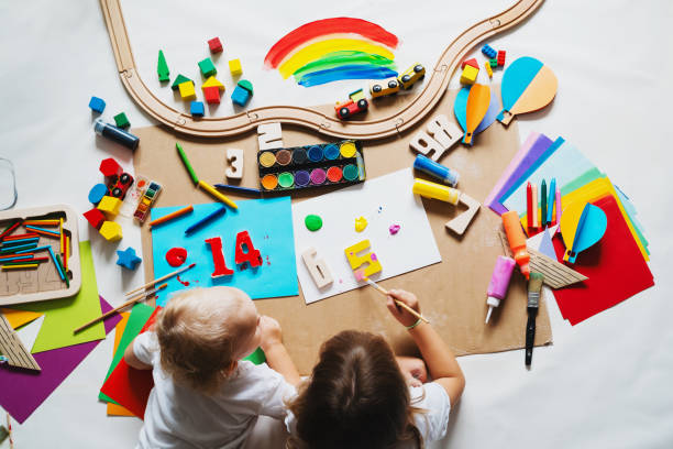 istock Children drawing and making crafts in kindergarten or daycare. 2173093879