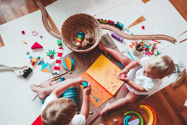istock Kids draw and make crafts. Kindergarten or preschool background. 2173094598
