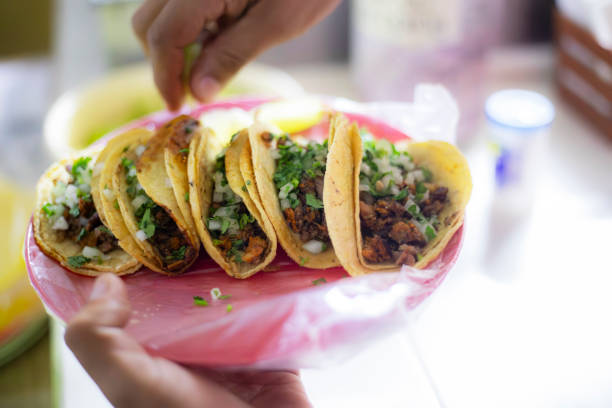 istock Man eating tacos in taqueria 2173095461