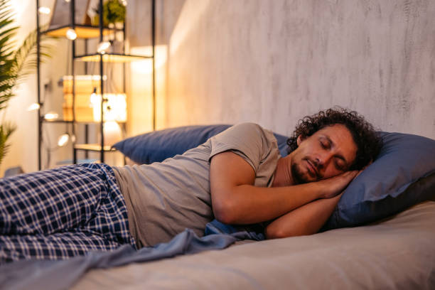 istock Mid-Adult Man Sleeping In The Bed At Night 2173095943