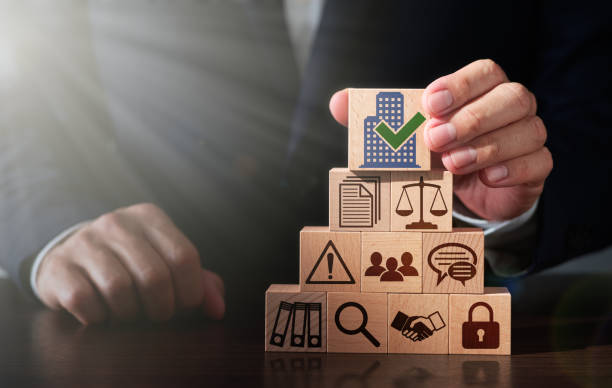 istock Building corporate governance structure. Businessman stacking wooden blocks. 2173095962