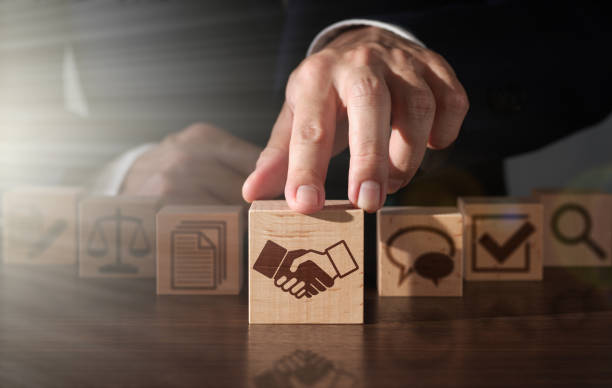 istock Successful contract negotiation strategy. Businessman moving a wooden block forward. 2173095998
