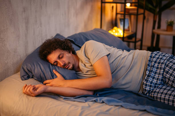 istock Mid-Adult Man Sleeping In The Bed At Night 2173096257